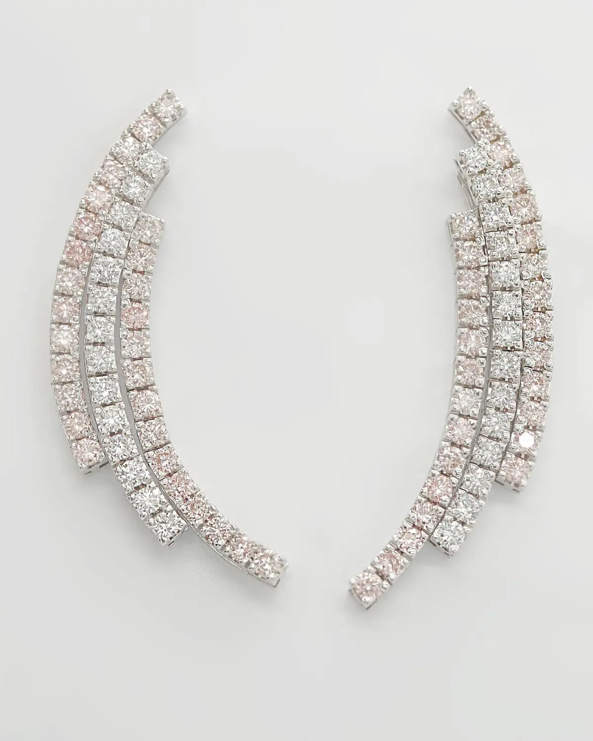 Pair of diamond earrings from Diamantea on a light background