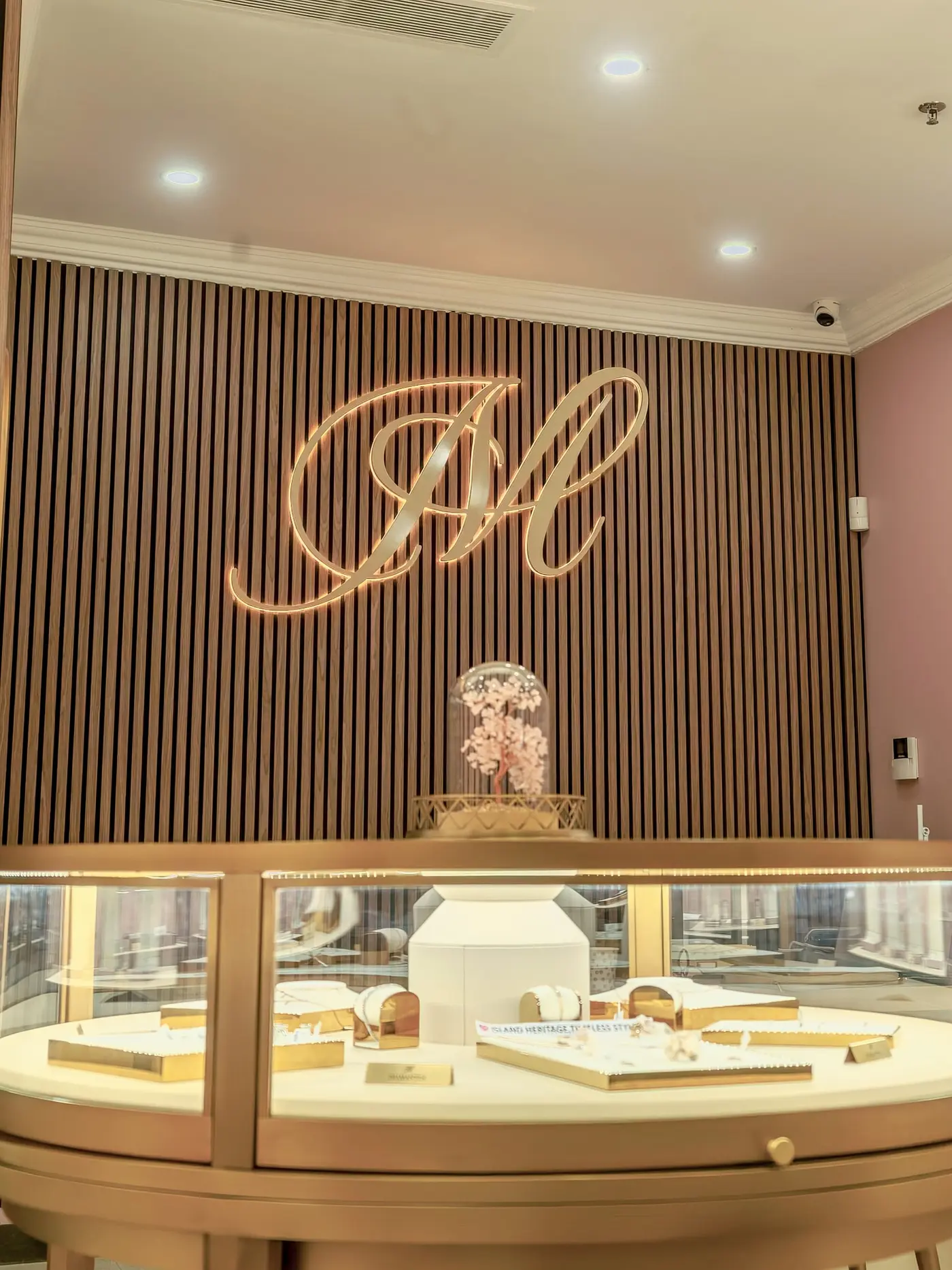 Diamantea jewelry counter with display cases and logo wall