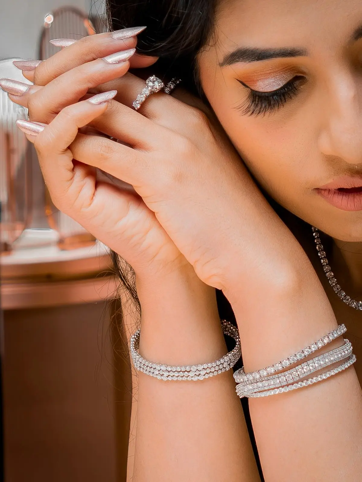 Stacked diamond bracelets worn together